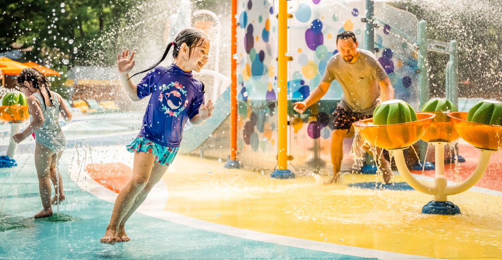 Girl playing in lil surfers splash pad