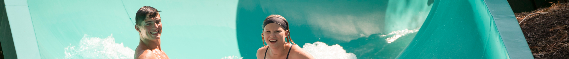 Friends riding Big Daddy Falls at Water Country USA. 